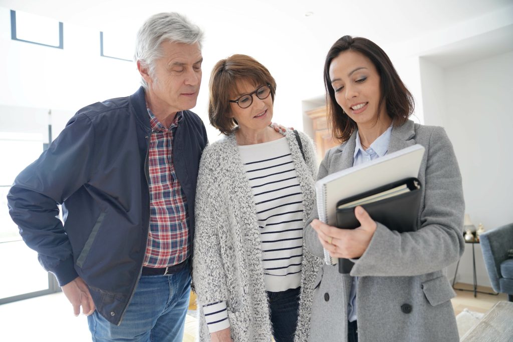 couple with real-estate agent. 